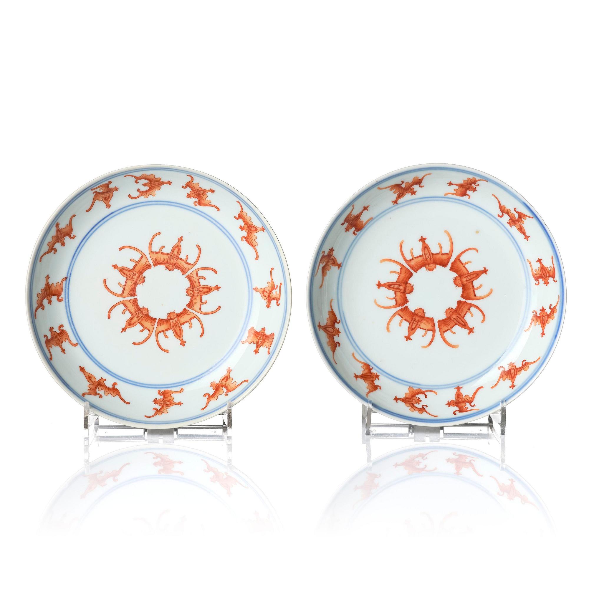 A pair of iron-red decorated 'bats' dishes, Qing dynasty, Guangxu mark and period (1875-1908).