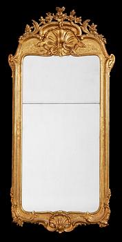 586. A Rococo 18th Century mirror.
