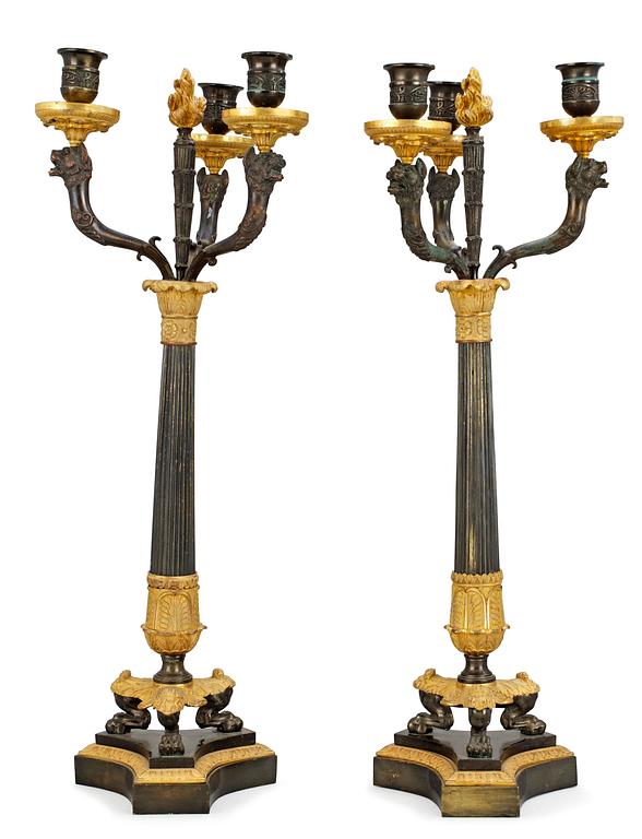 A pair of three-light candelabra, late Empire-style.