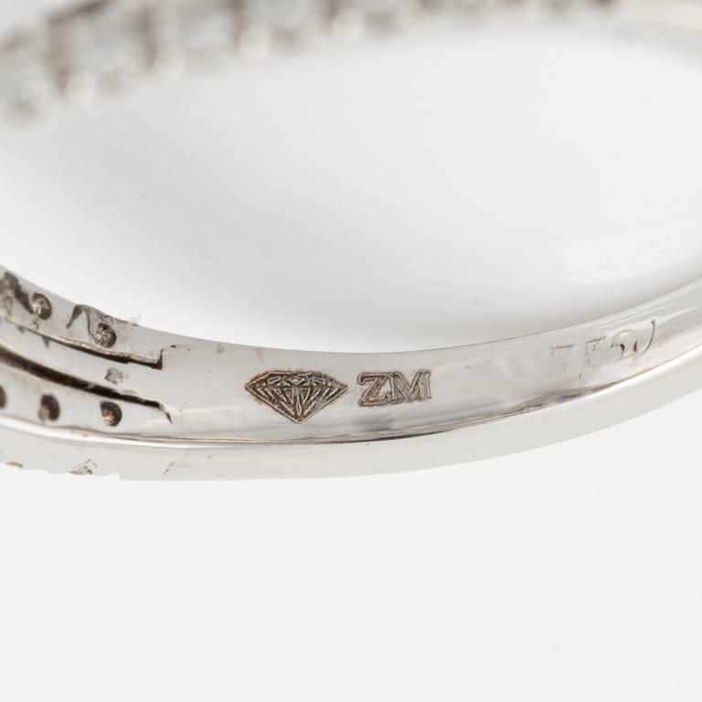Oval sapphire and brilliant cut diamond ring.