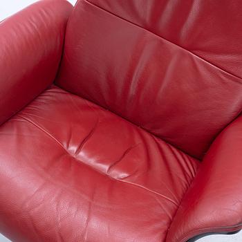 A pair of armchairs with footstool, "Timeout" by Conform, late 20th century.