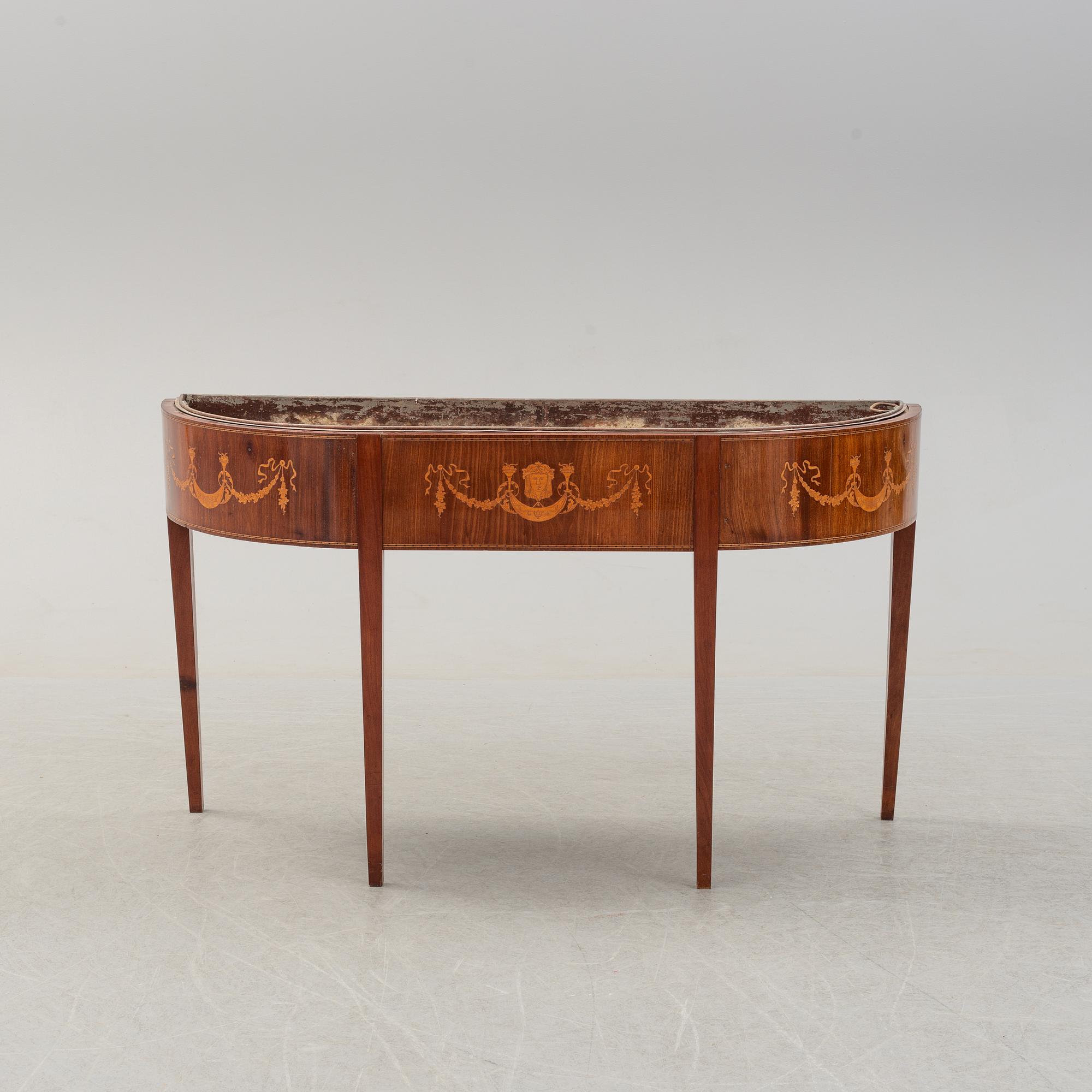 A late 19th century mahogany flower table.
