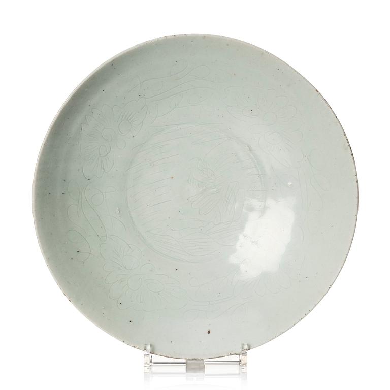 A large pale celadon glazed dish, Yuan/Ming dynasty.