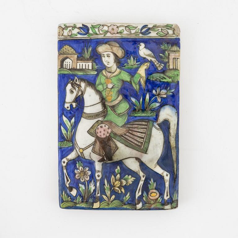 A Persian (Iranian) tile, glazed pottery, Qajar dynasty, 19th century.