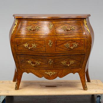 A mid 20th century rococo style chest of three drawers.