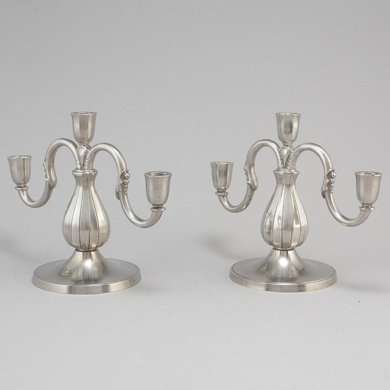 A pair of pewter candelabra from GAB Tenn, Stockholm, 1935.