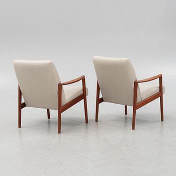 A pair of mid-century easy chairs.
