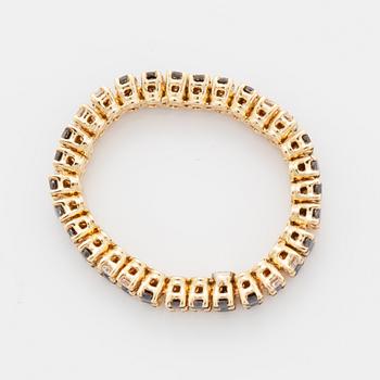 White and black brilliant-cut diamond ring.