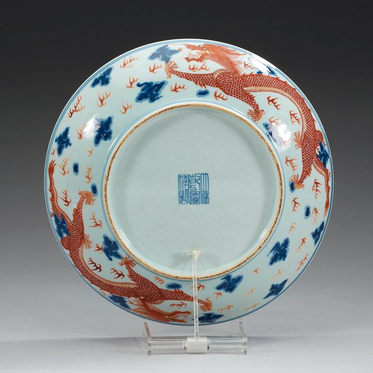 A blue and white and red overglaze dragon dish, presumably Republic with mark in underglaze blue.