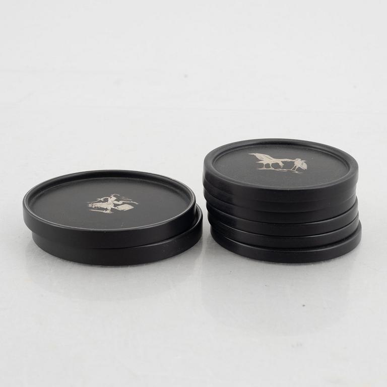 Eight coasters, Isolit with silver inlays, 1937-53.