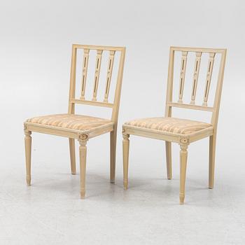 A Gustavian style table and ten chairs, second half of the 20th Century.