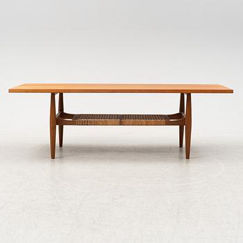 A composite teak coffee table with a rattan shelf, Denmark, 1950/60s.