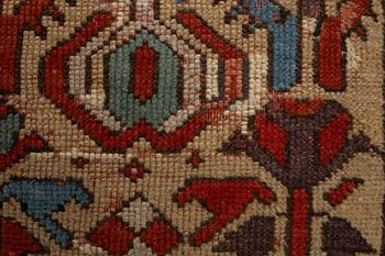 A rug, antique Anatolian/Caucasian, ca 148-149 x 104,5-110 cm (as well as 1-1,5 cm flat weave at one end).