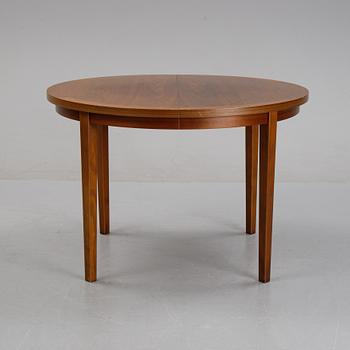 A mahogany veneer dining table, second half of the 20th century.