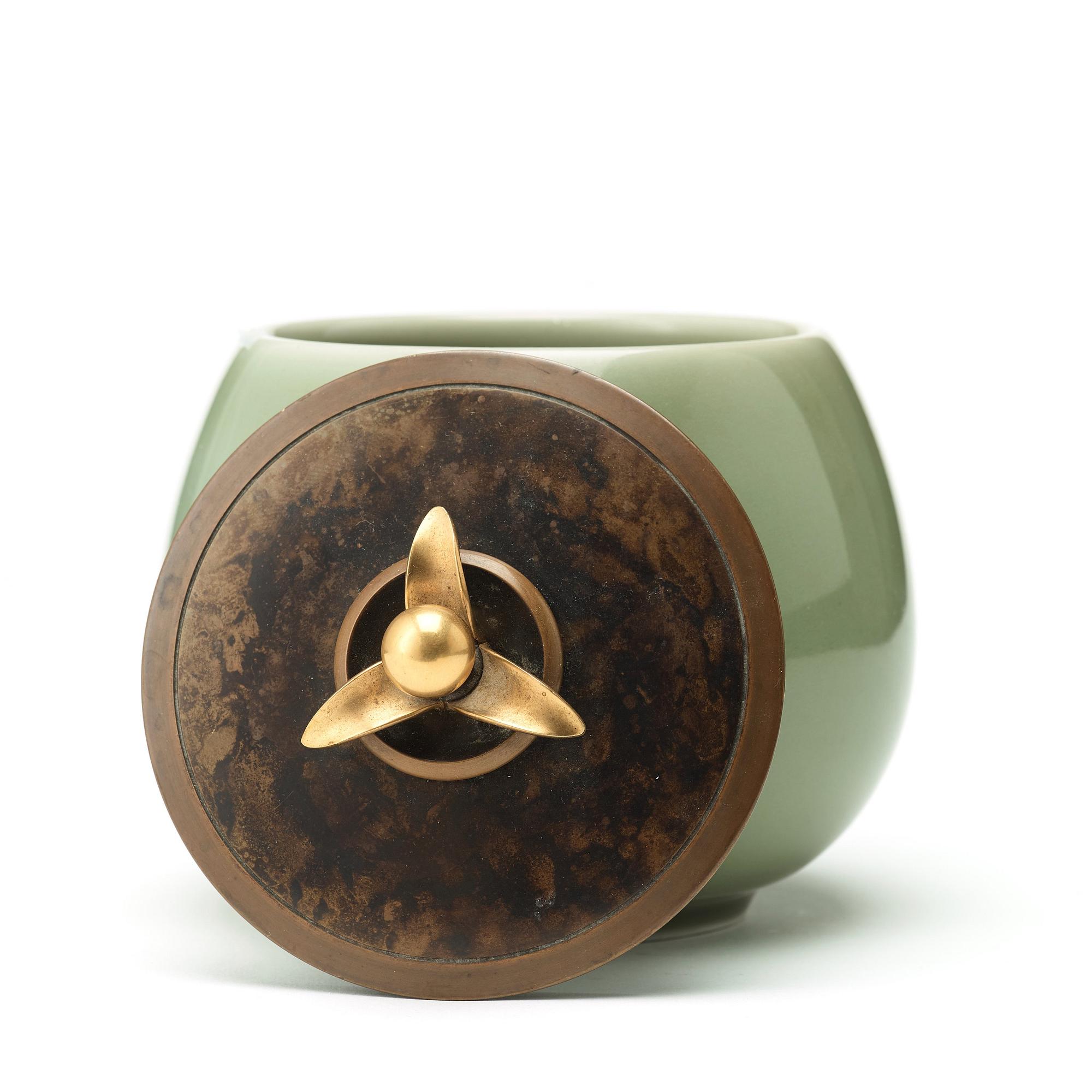 A Royal Copenhagen porcelain bowl with a patinated bronze cover, probably by Knud Andersen, Denmark 1957.