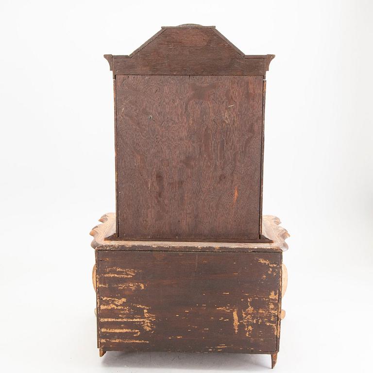 A Louis XV-style miniature cabinet around 1900.