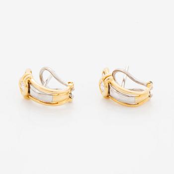 A pair of 18K gold earrings.