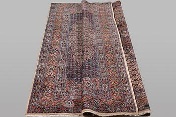A carpet, Moud, signed, ca 385 x 268 cm.