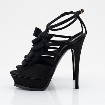 Yves Saint Laurent, a pair of black silk and bows platform sandals, size 37.