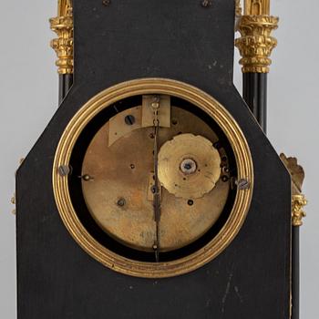 A gothic revival mantel clock.