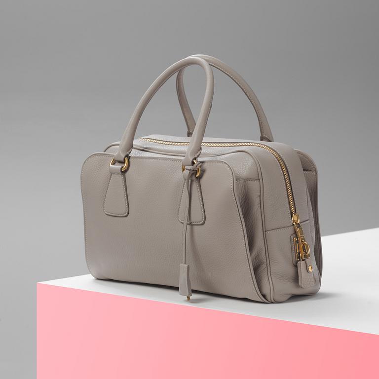 A leather handbag by Prada.