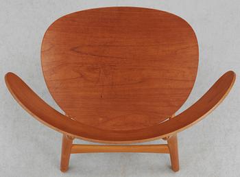 A Hans J Wegner teak and beechwood 'shell chair', Fritz Hansen, Denmark 1950's.