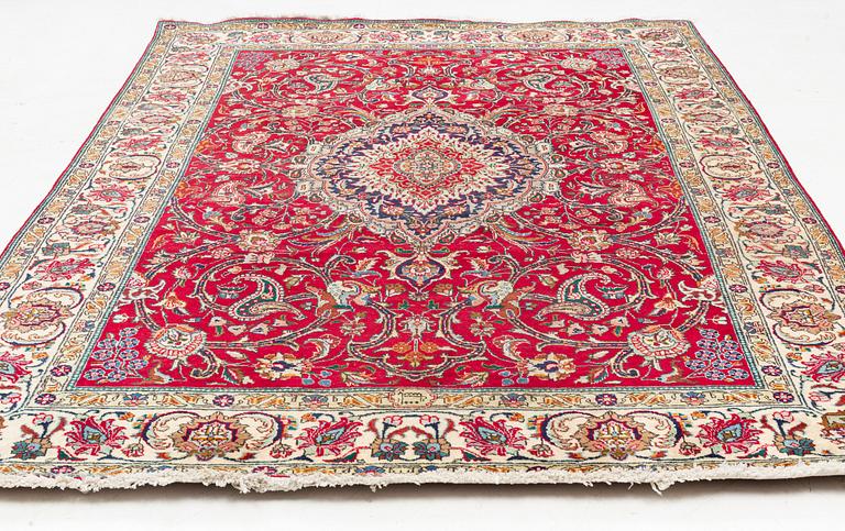 A Tabriz Carpet, circa 316 x 220 cm.