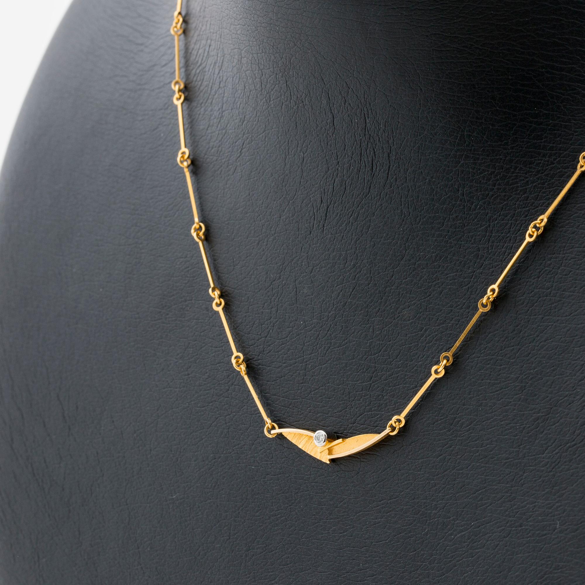 LAPPONIA NECKLACE 18K gold 1 brilliant-cut diamond 0,03 ct engraved, Finland 2002.