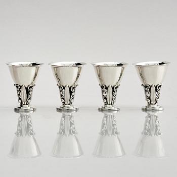 Evald Nielsen, four sterling silver beakers/cups on a foot, Denmark 20th century.