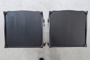 A pair of Rococo-style bedside tables later part of the 20th century.