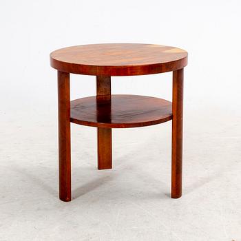 A veneered table from the first half of the 20th century.