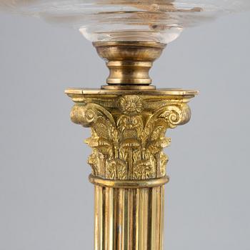 A brass oil lamp, ca 1900.