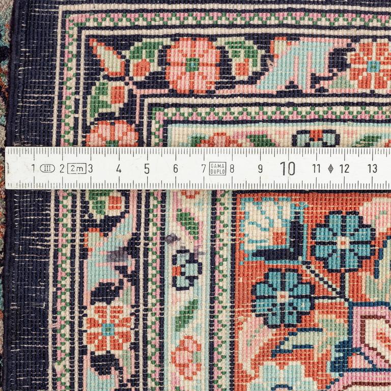 An oriental carpet, mercerized cotton, c. 275 x 182 cm.