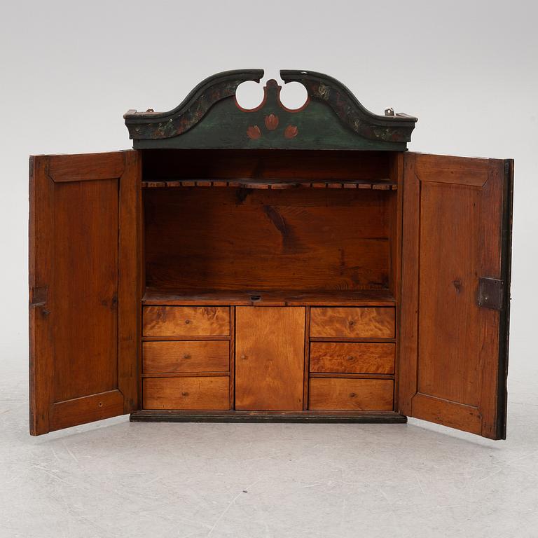 A wall-hanged cabinet, Sweden, dated 1851.