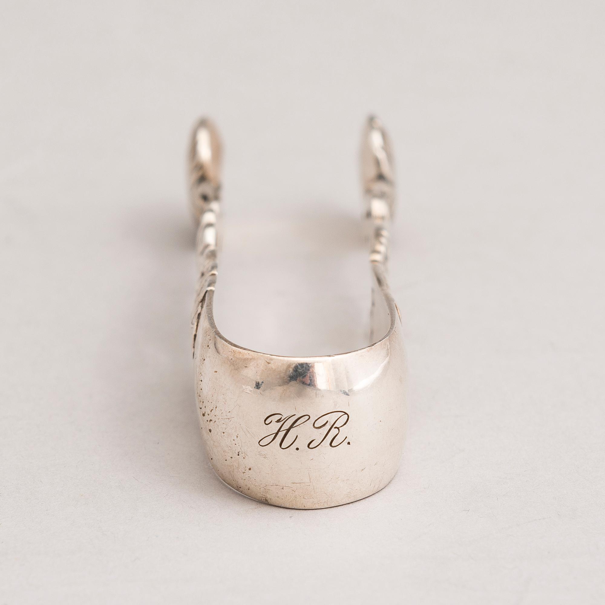 A silver sugar tong and a 3-piece silver coffee set, mark of Juho H. Pekuri, Oulu 1931 and Finnish import marks 1938.