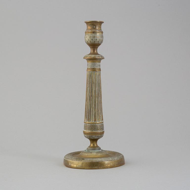 A first half of the 19th century Empire bronze candlestick.