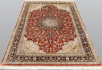 An oriental silk carpet, ca 246 x 155 cm.