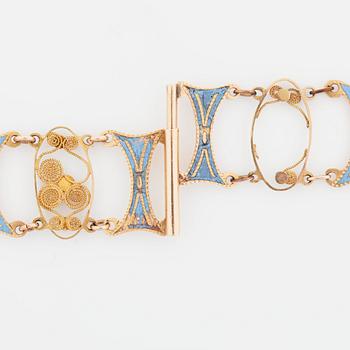 GARNITYR bestående av collier samt två armband med ljusblå emalj samt filigranarbete. Empire.