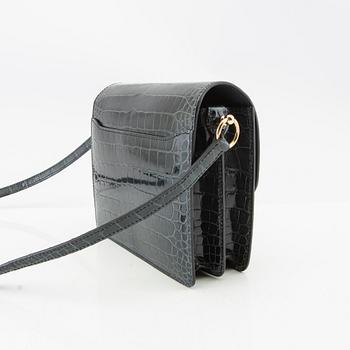 Hermès, bag "Green Shiny Alligator Mini Roulis 18 Permabrass Hardware" 2021.
