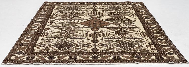 A Ferdos carpet, c. 295 x 210 cm.
