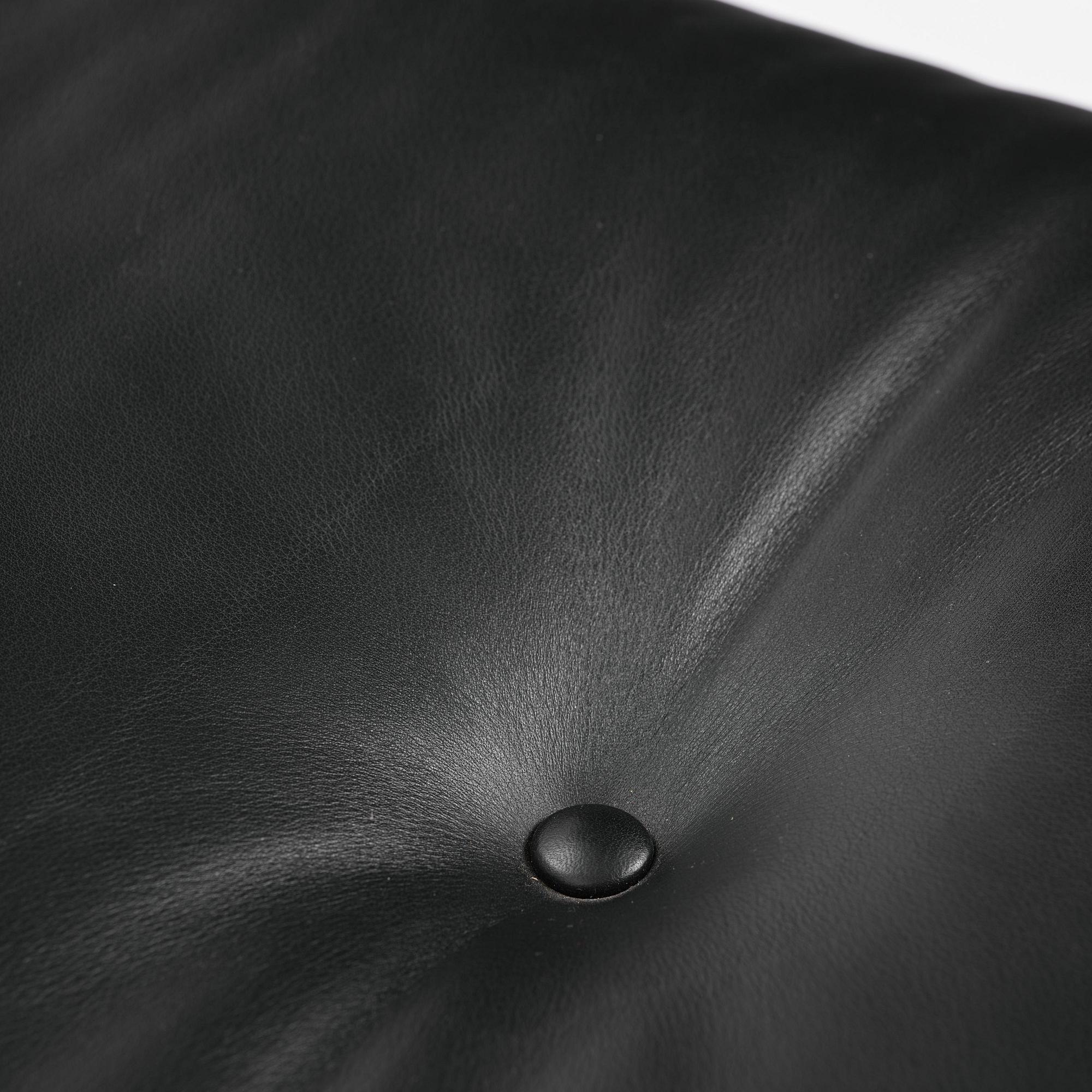 Charles & Ray Eames, an "Eames Lounge Chair" with ottoman, Vitra, 2000s.