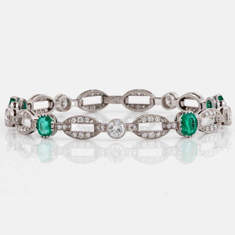 An 18K white gold bracelet set with faceted emeralds.