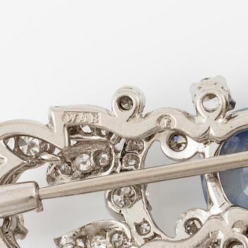 A W.A. Bolin brooch in platinum with a faceted sapphire.
