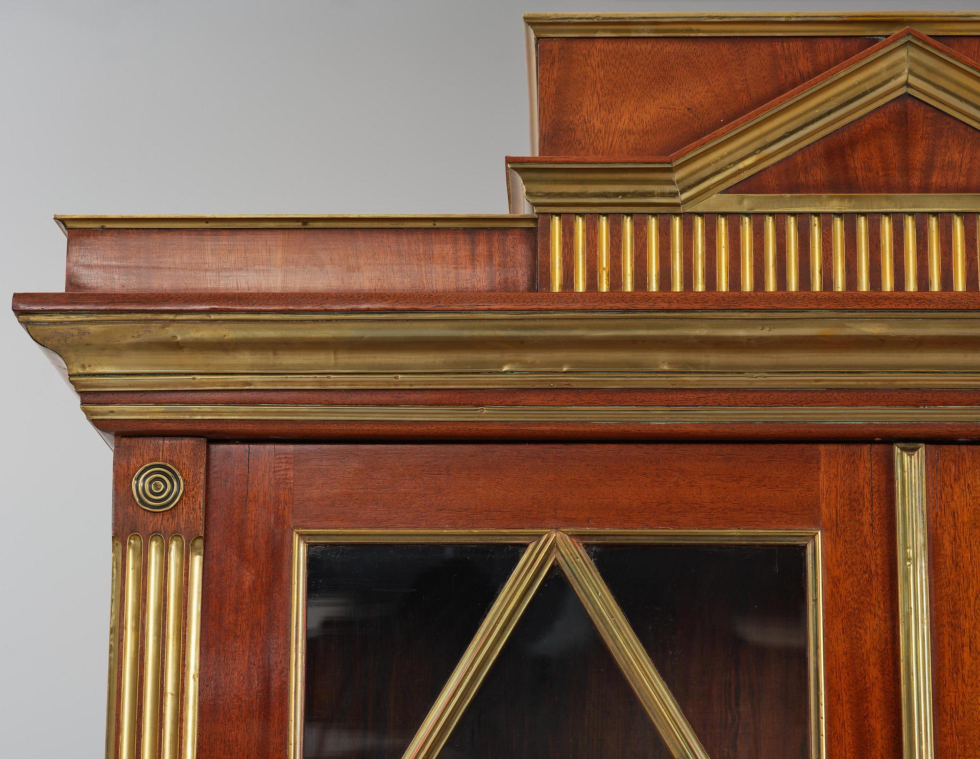 A pair of Russian mahogany and brass-mounted Jacob-style bibliothèques, modern with old parts.