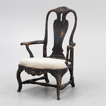 A Rococo armchair, later part of the 18th Century.