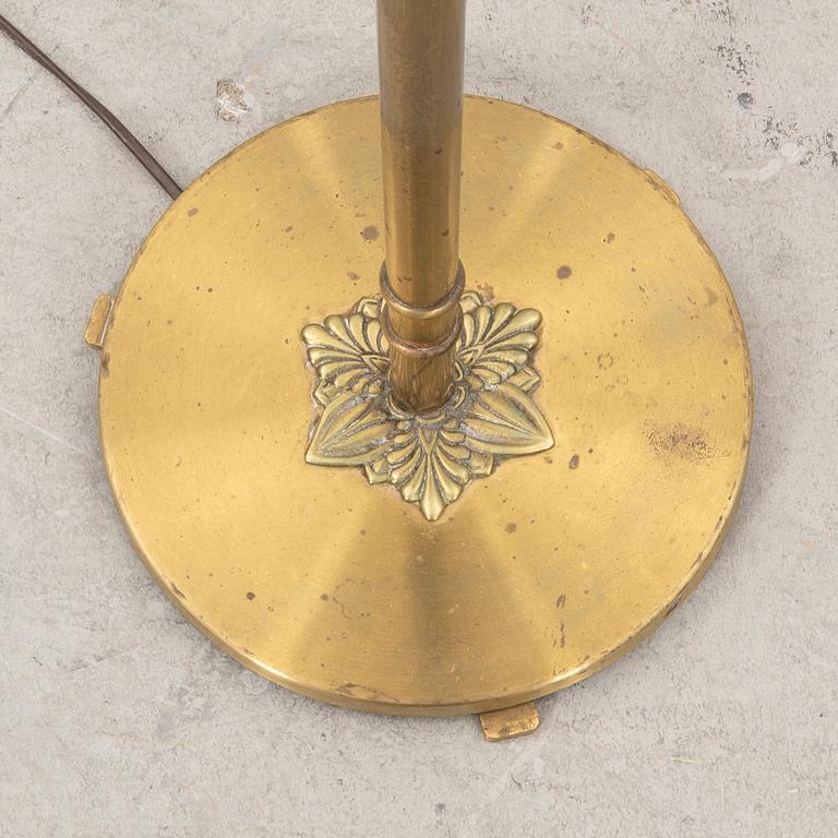 A 1940s brass floor lamp.