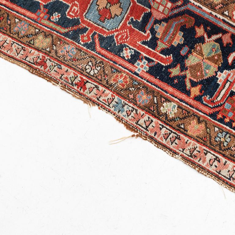 A antique Heriz carpet, ca 384 x 275 - 290 cm.