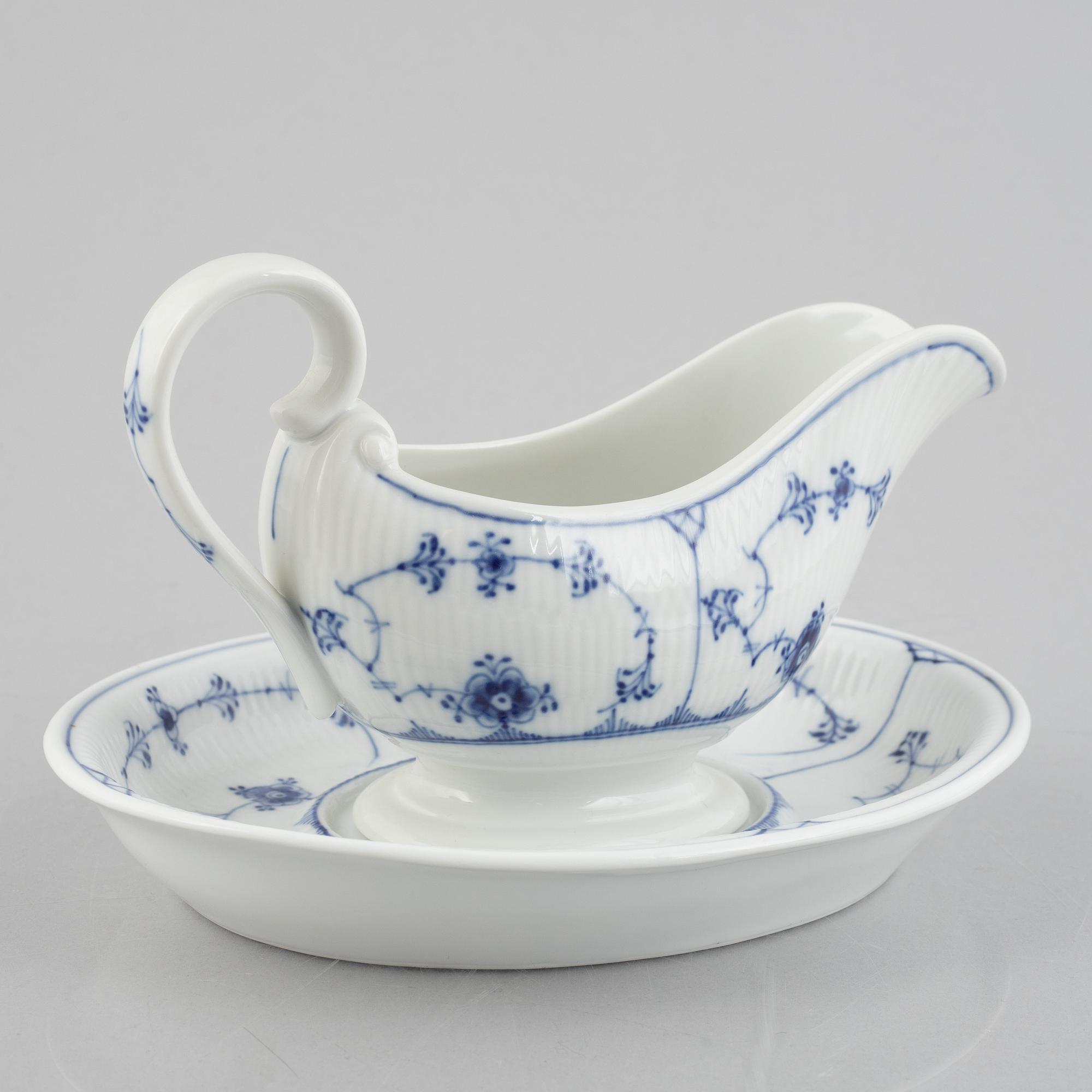 A 'Blue Fluted Plain' /'Musselmalet' sauce boat with stand, Royal Copenhagen, model 406 and 409, 1963 and 1893-1900.
