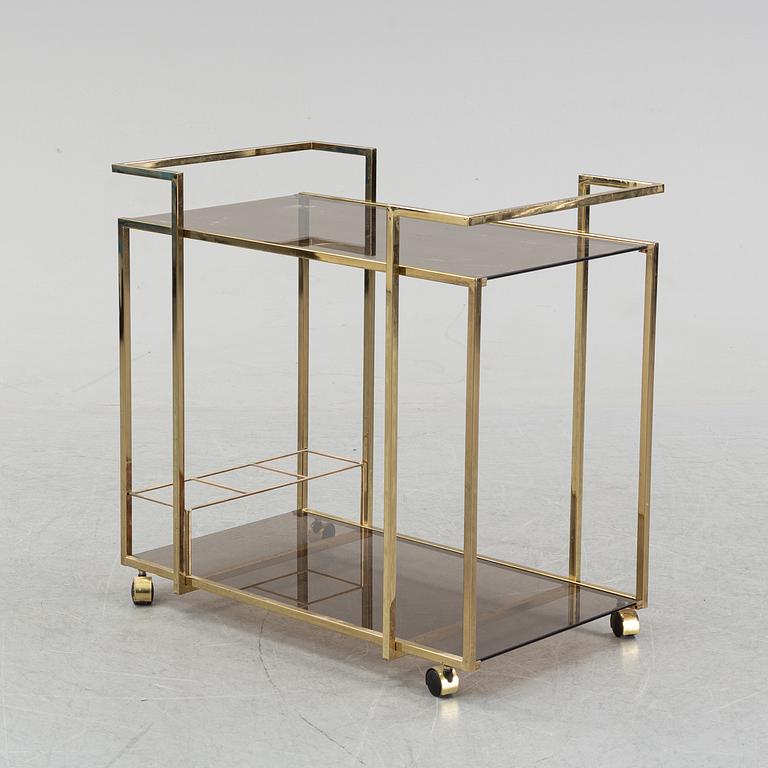 A brass and glass drink trolley, end of the 20th Century.