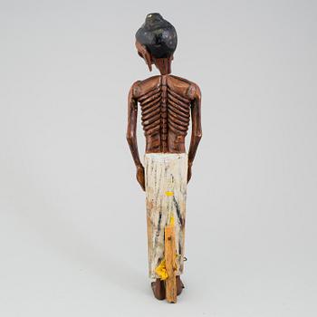 A wooden sculpture of a indian man, early 20th Century.